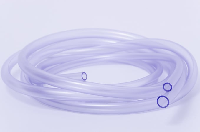 Chemical etching of fluoropolymers for improved coating adhesion